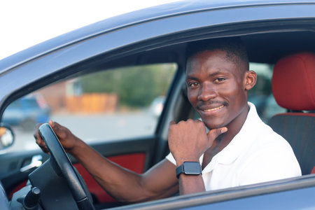 Un jeune chauffeur dans sa voiture Un jeune chauffeur dans sa voiture